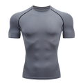 Remera deportiva ajustada de hombre de manga corta