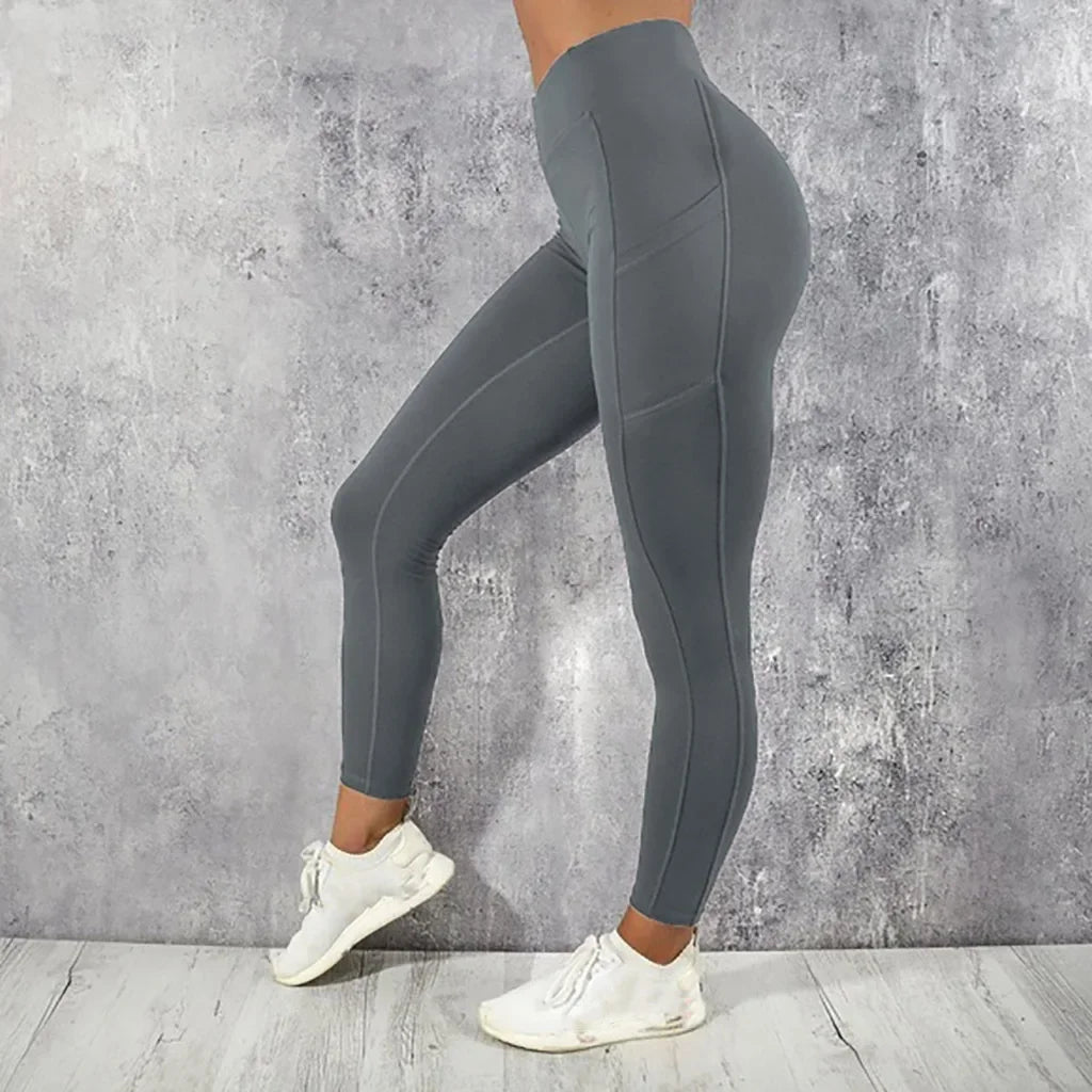 Calza de entrenamiento de tiro alto con bolsillo