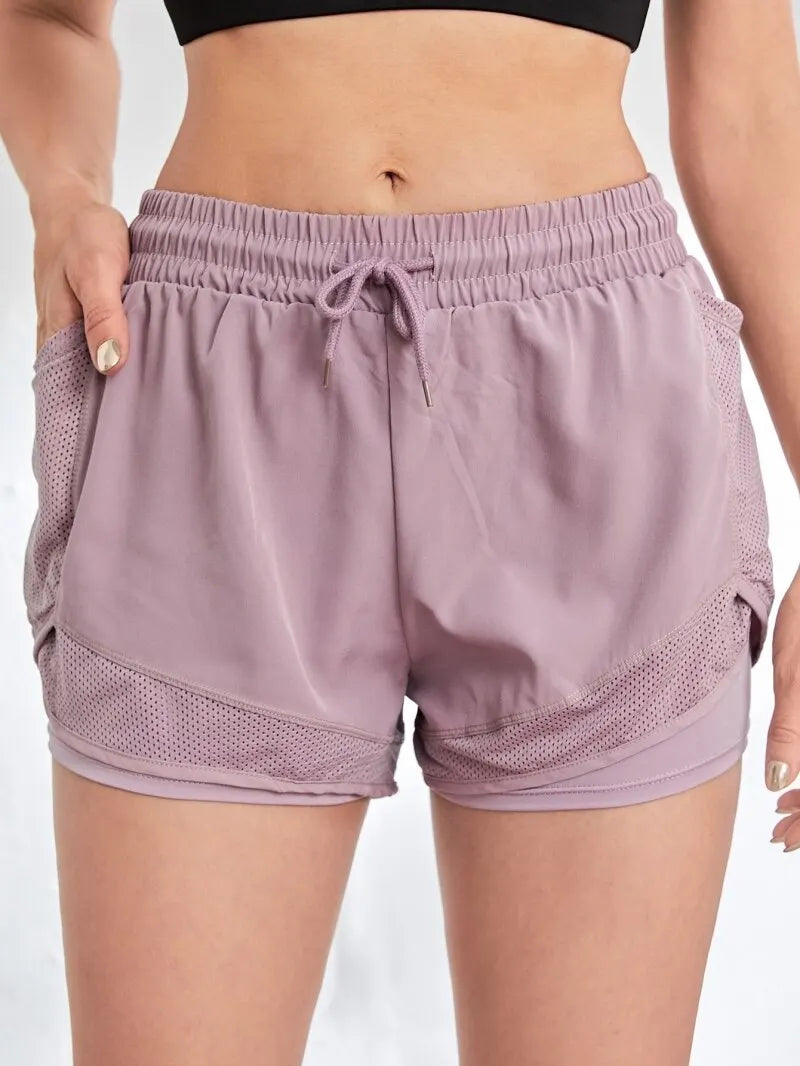Short deportivo con bolsillos y efecto doble capa
