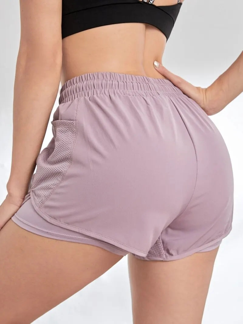 Short deportivo con bolsillos y efecto doble capa