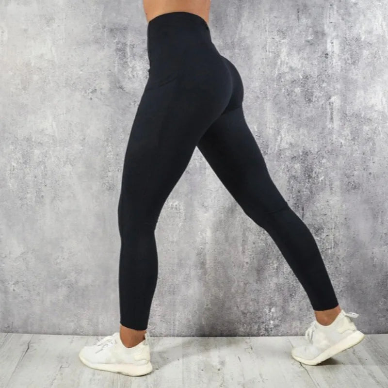 Calza de entrenamiento de tiro alto con bolsillo