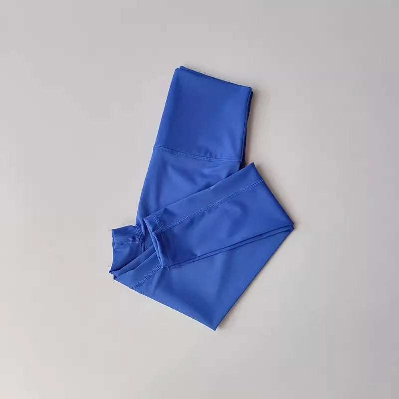Conjunto deportivo de top y calza de tiro alto con bloques de color
