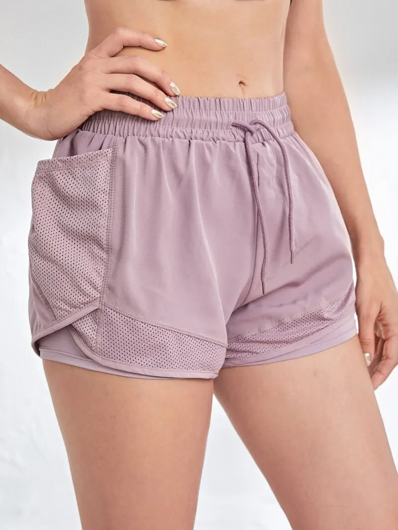 Short deportivo con bolsillos y efecto doble capa