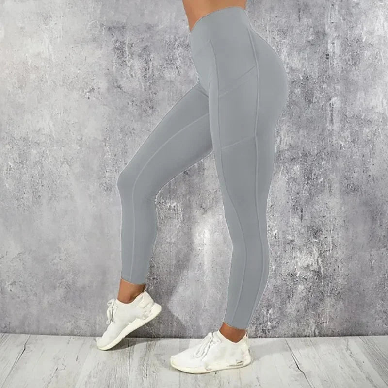 Calza de entrenamiento de tiro alto con bolsillo